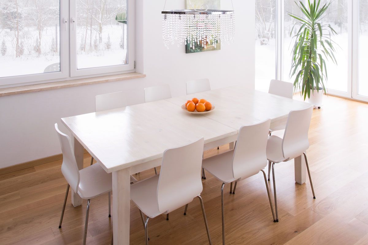 Dining table set in bright modern interior