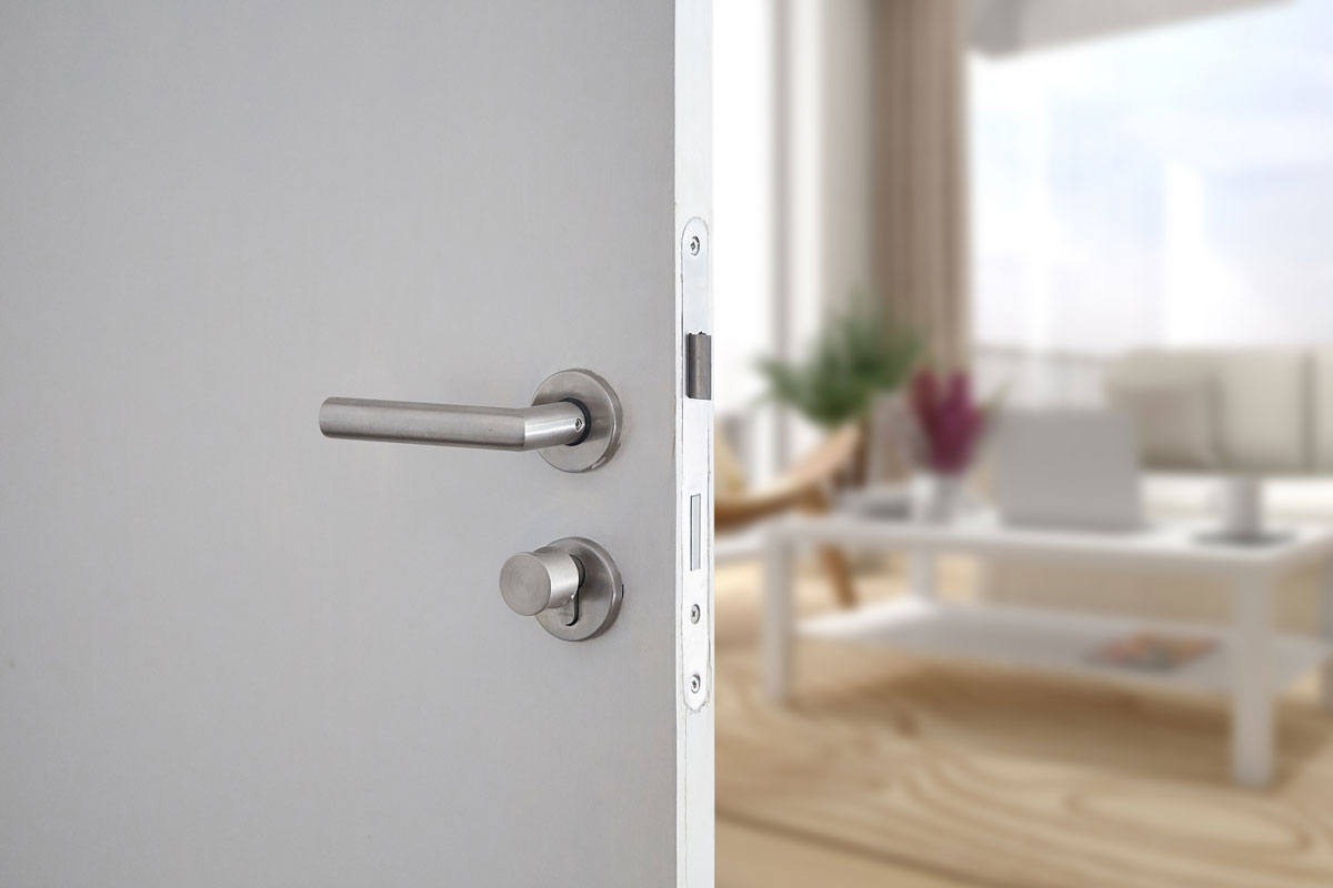 Door handle , door open in front of blur interior room