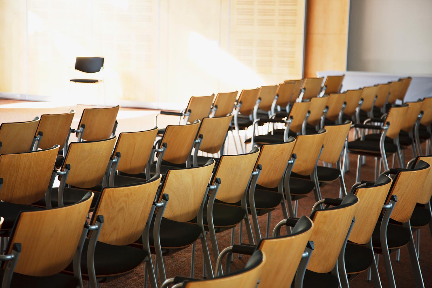 Empty chairs lined up for seminar
