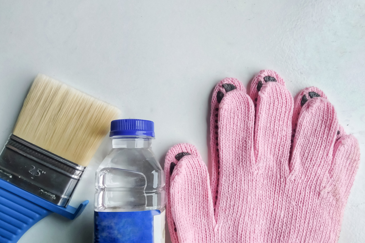 Equipment needed for painting which consists of thinner gloves and brush.