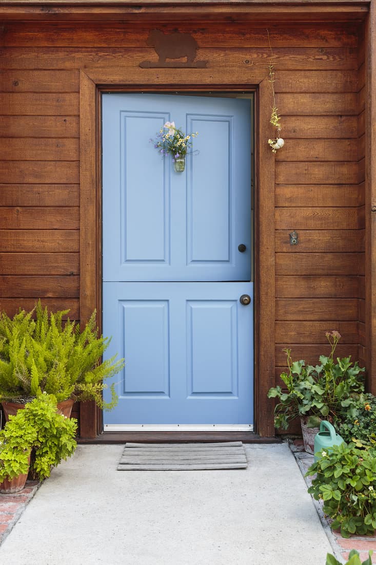 Front view of a blue Dutch door