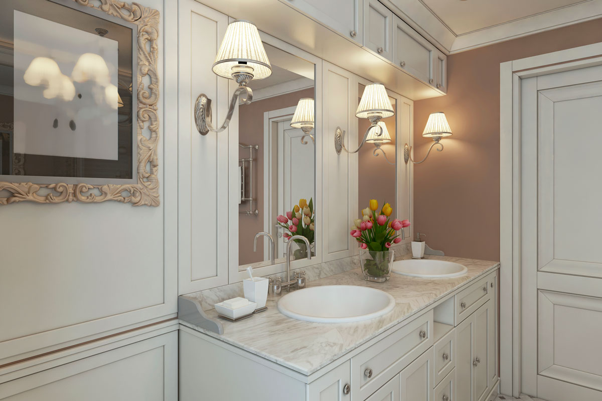 Gorgeous classic inspired bathroom design with white painted walls, marble countertop and tulips on the top