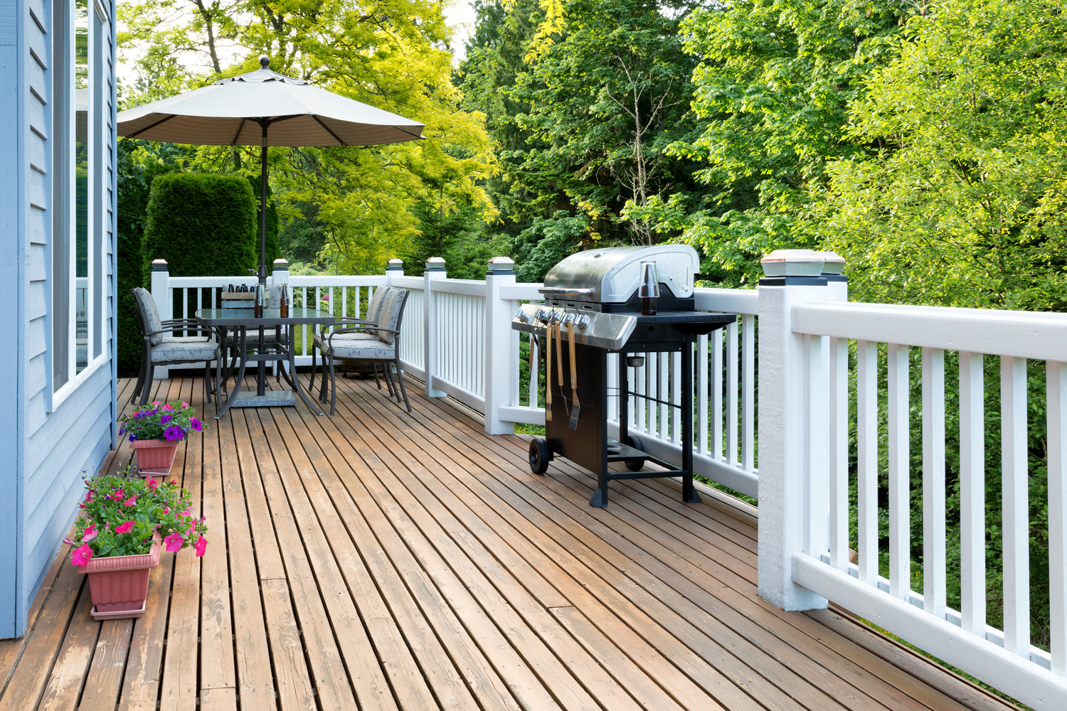 Home deck and patio with outdoor furniture and BBQ cooker with b — Photo