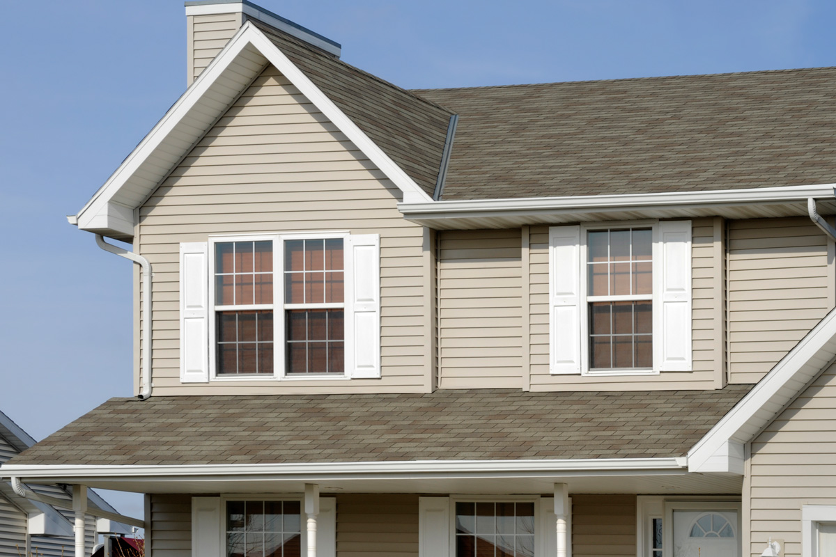 If you require a shot of a new home or any of the array of building products shown, this would be a great image for you. It shows, architectural asphalt shingle roof, vinyl siding, windows, vinyl shutters, seamless aluminum gutters.