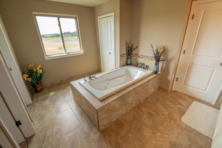 An interior of a bathroom with a window, Should All Doors In A House Match?