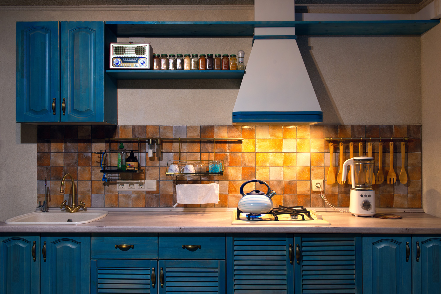 Kitchen with blue boiling kettle in the interior