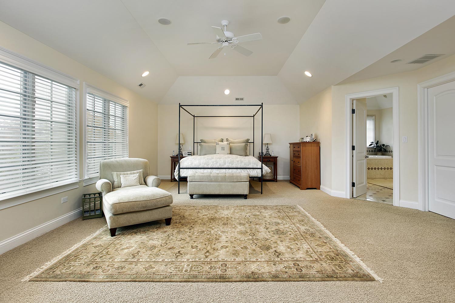 Master bedroom in luxury home with tray ceiling