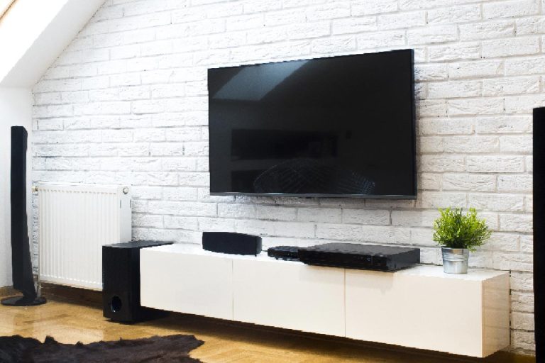 A modern apartment with home theater, How Much Space Between Mounted TV And Console?