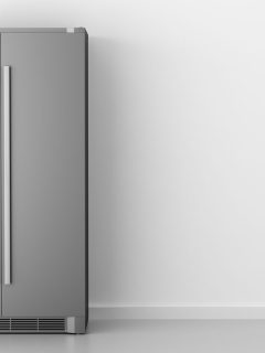Modern gray fridge on a white wall, How To Find The Model Number On A Frigidaire Refrigerator