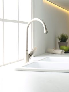 New ceramic sink and modern tap in stylish kitchen interior, 7 Best Sink Repair Kits [Porcelain And Ceramic]