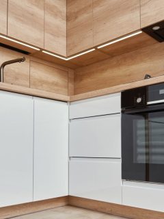 New modern kitchen interior, Minimal design with white cupborads, sink electrical oven and gas hob, How Much Space Between Oven And Cabinets?