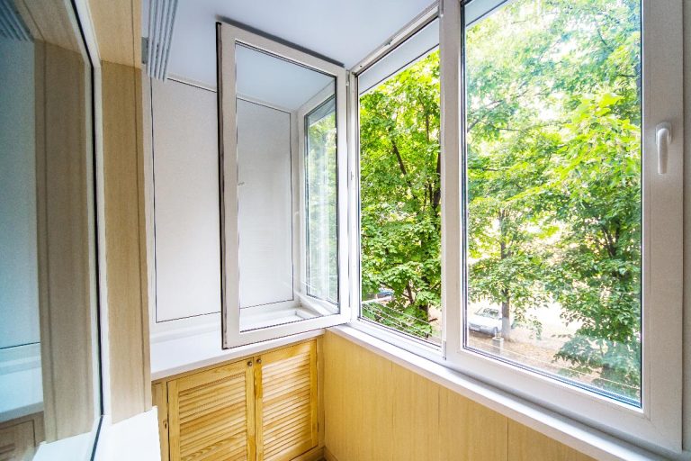 An open window with a view of the forest, What Color To Paint Window Sills? [4 Options Explored]