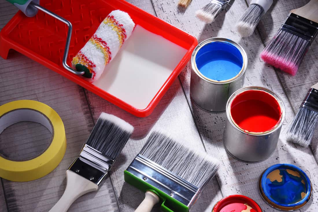 Paint mixing equipment's and paint buckets on the floor
