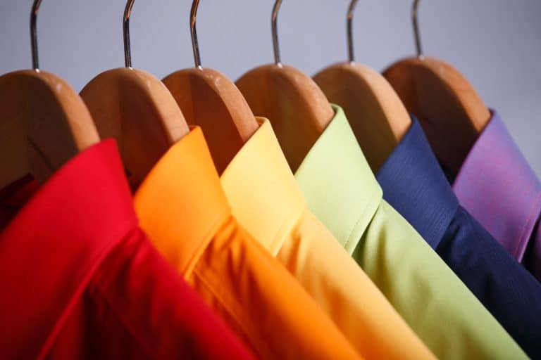 Rainbow colored shirts on hangers - How High Should Closet Shelves And Rod Be