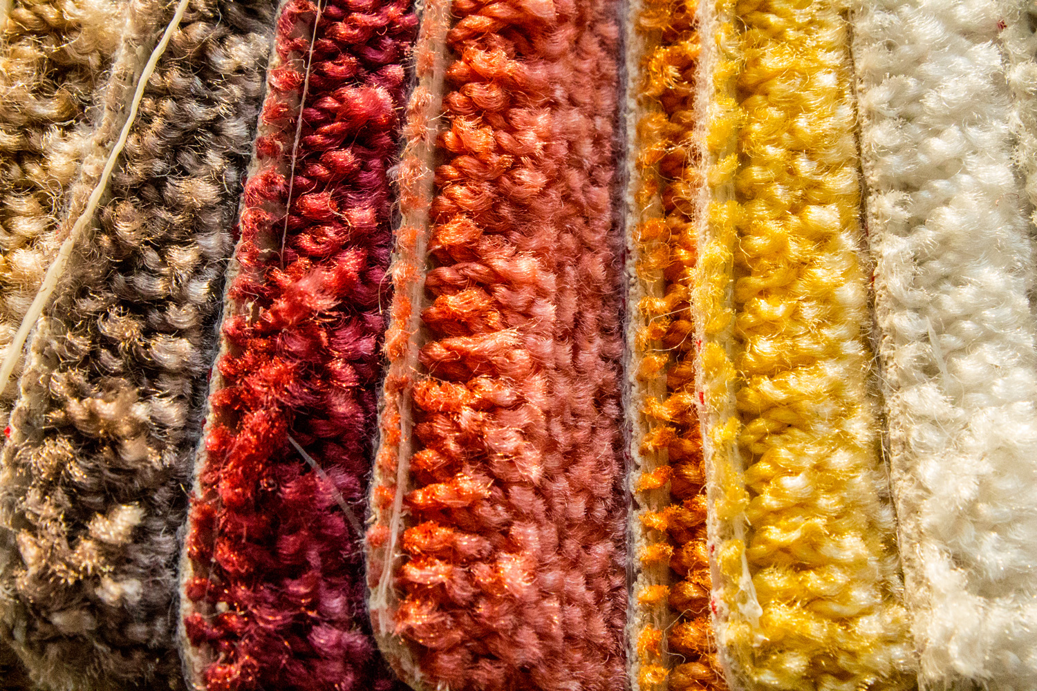 Samples of a multi-colored carpet, an example of pile and carpet color