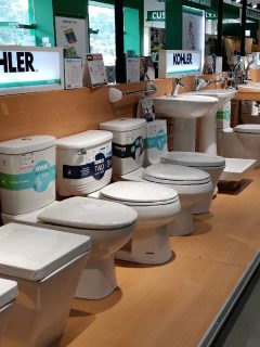 A selection of kohler toilet bowl designs with different features inside a home depot store, How To Find The Model Number On A Kohler Toilet