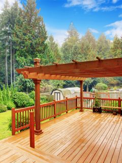 Spacious wooden deck with benches and attached pergola - How Long Does It Take To Refinish A Deck