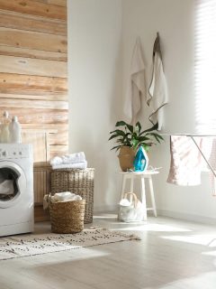 Stylish room interior with modern washing machine and drying rack, 15 Wall Decor Ideas For Laundry Room