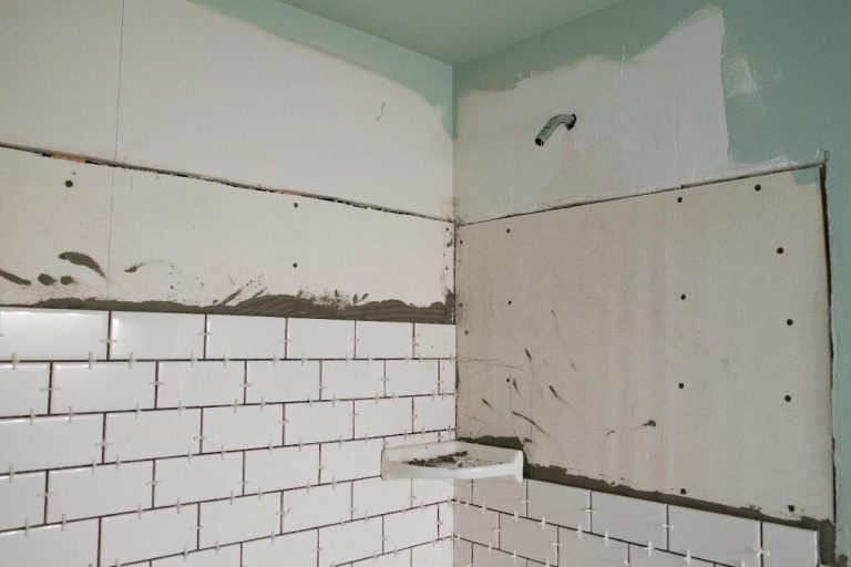 A tall shower with white subways tiles set vertically on cement backer board, How Many Screws Per Sheet Of Durock?