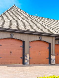 Triple doors garage with wide long driveway