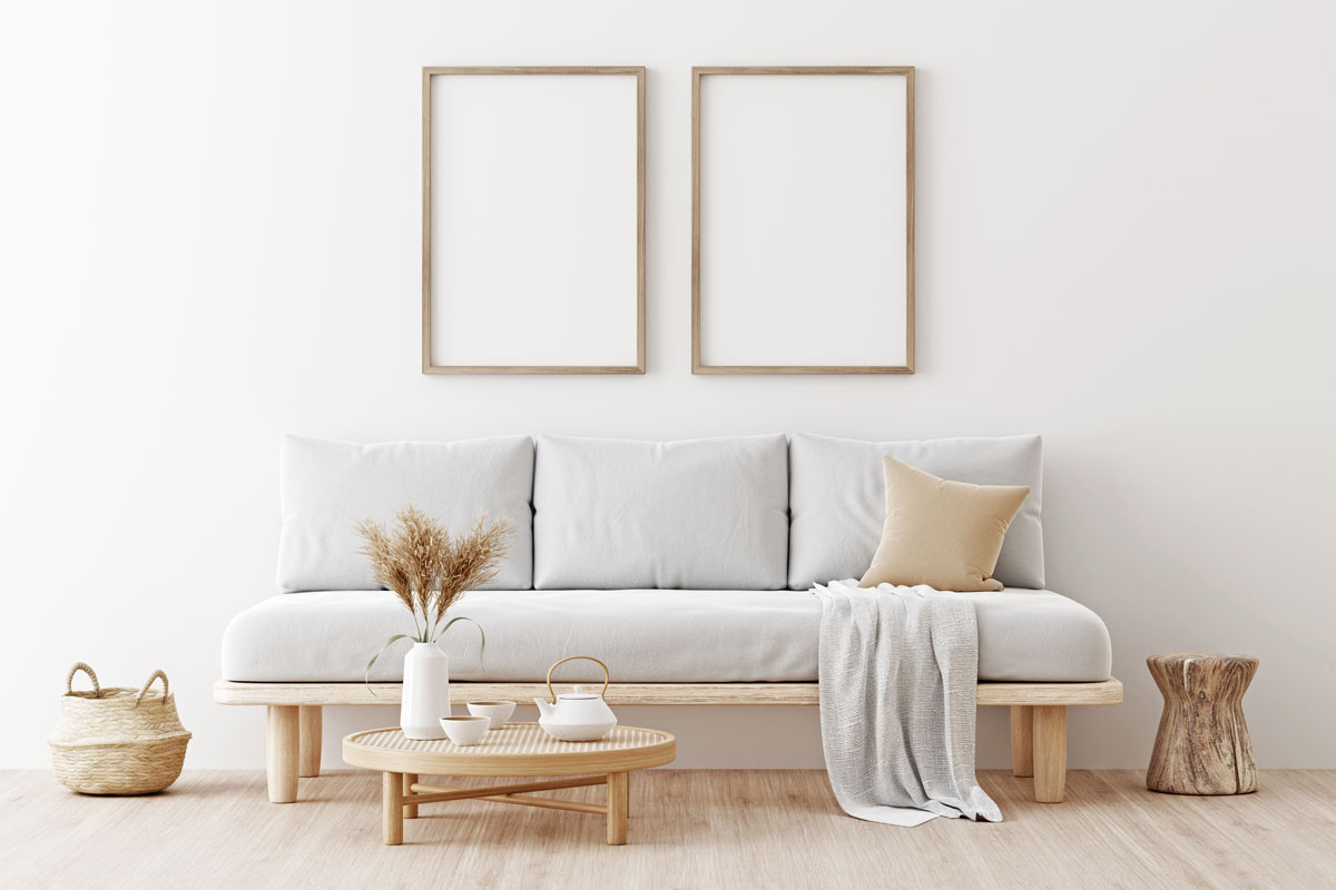 Two wooden vertical frames mockup in living room interior with gray sofa, beige pillow