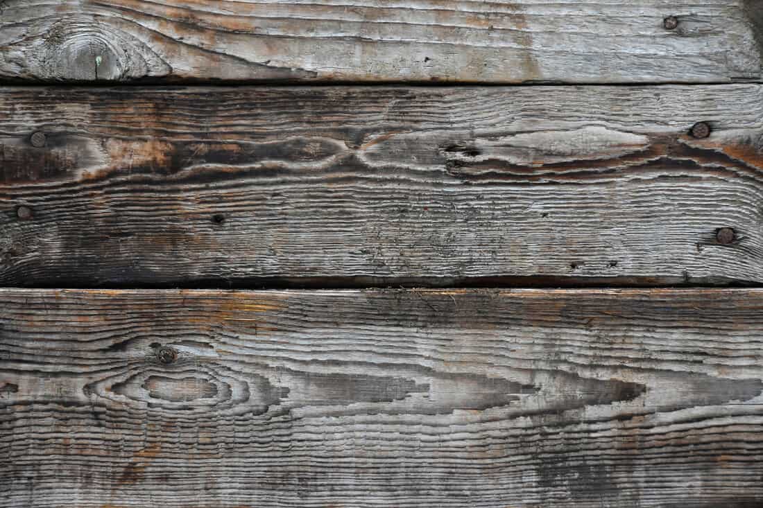 Vintage wooden panel with horizontal planks and gaps 