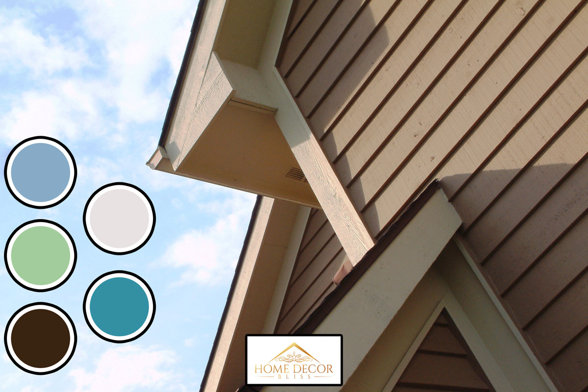 House roof elements with cedar wood siding, blue sky and clouds, What Color Goes With Almond Siding?