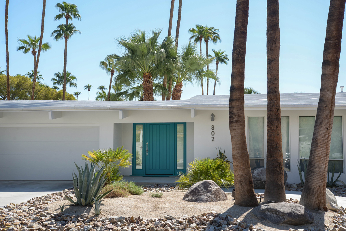 White Palm Springs house with aqua blue door