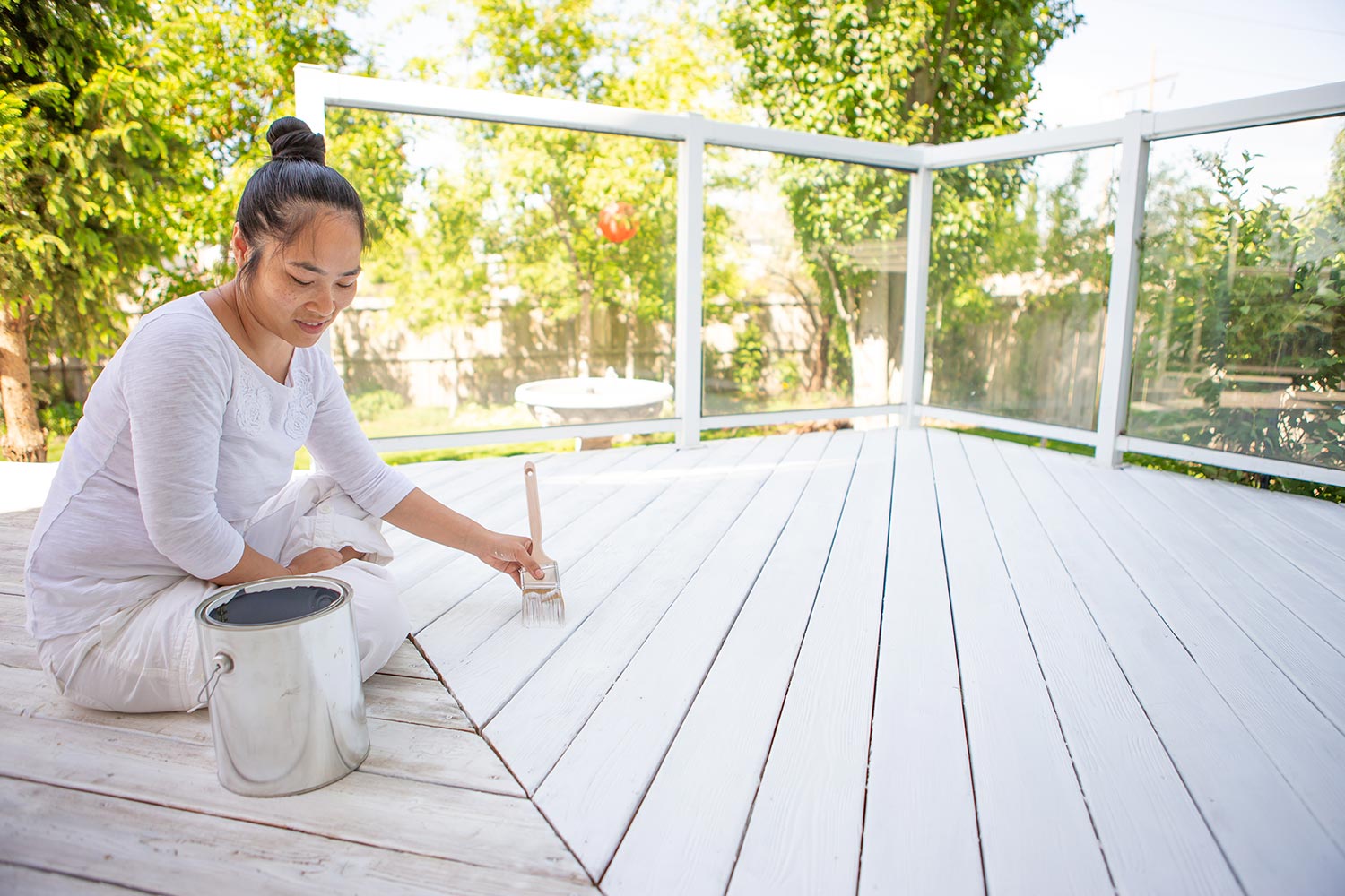 Woman painting deck