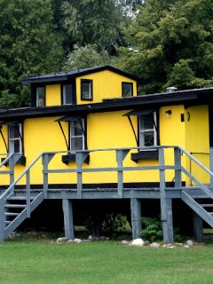 A yellow house with gray deck, What Color Deck Goes With A Yellow House?