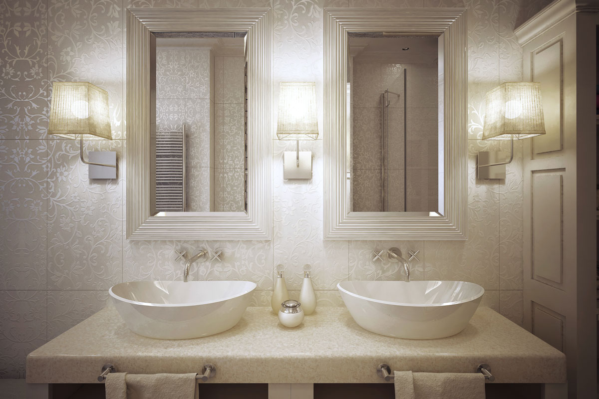 Classic designed bathroom vanity with sconces near the mirrors