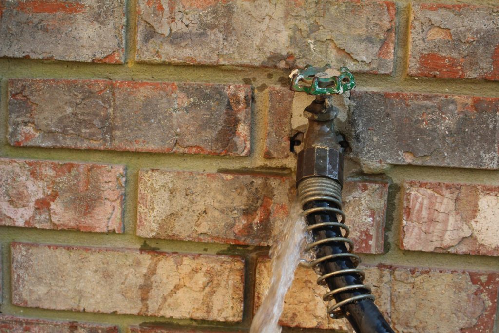 leaking outdoor faucet - spigot and hose