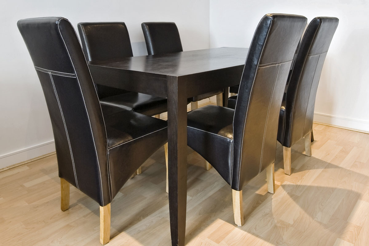 modern mahogany dining table with six leather chairs