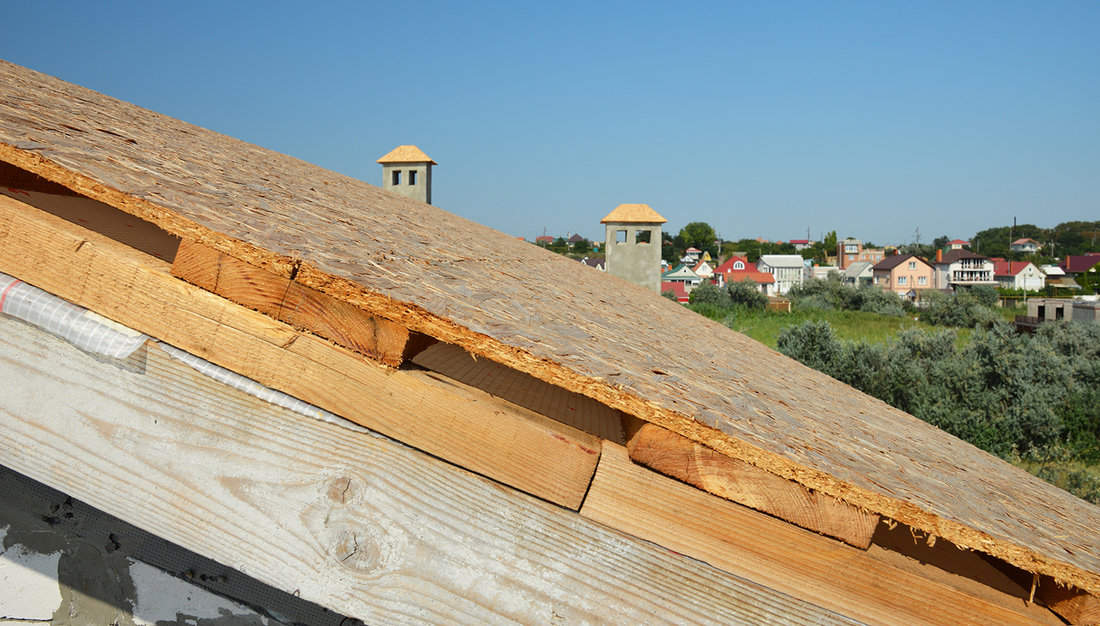 A close-up of a roof under construction on the stage of roof sheathing