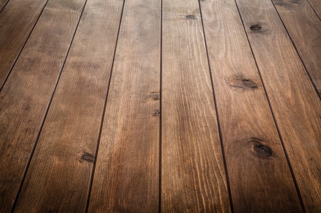 A wooden deck at the back of a house