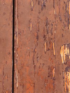 Aged wood background, peeling red paint, hole, old wooden rotten timber - How To Fill Holes In Wood [Even Without Wood Filler]