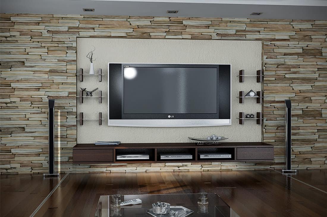 An awesome TV stand and indoor long stone brown veneer matching the hardwood flooring