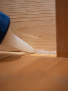 Applying Silicone Caulking Between Wood Floor and Wall - How To Seal A Gap Between Wall And Floor