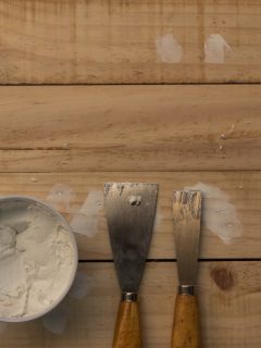 Applying putty on holes at the wood deck, Should I Fill Cracks In Wood Deck? (And What Filler To Use)