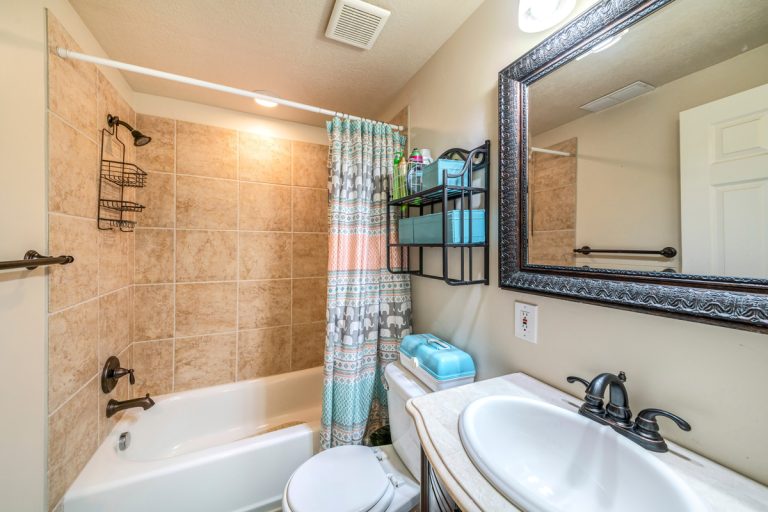 Bathroom interior with antique fixtures and ceramic tile walls,Can A Shower Caddy Be Too Heavy For Shower Head?