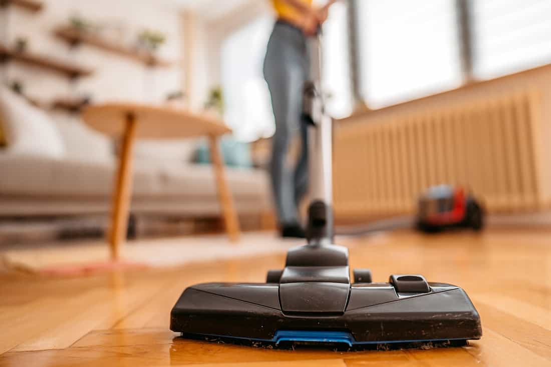 Cleaning floor with vacuum cleaner