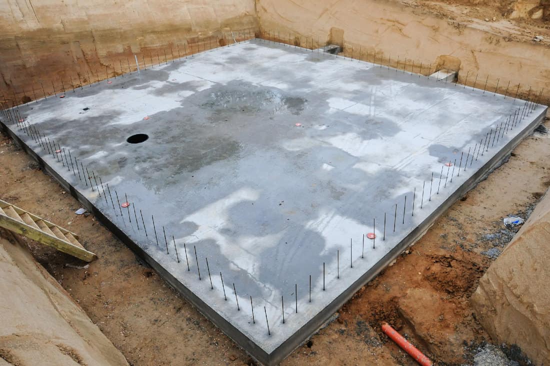 Concrete base in an excavation for a house