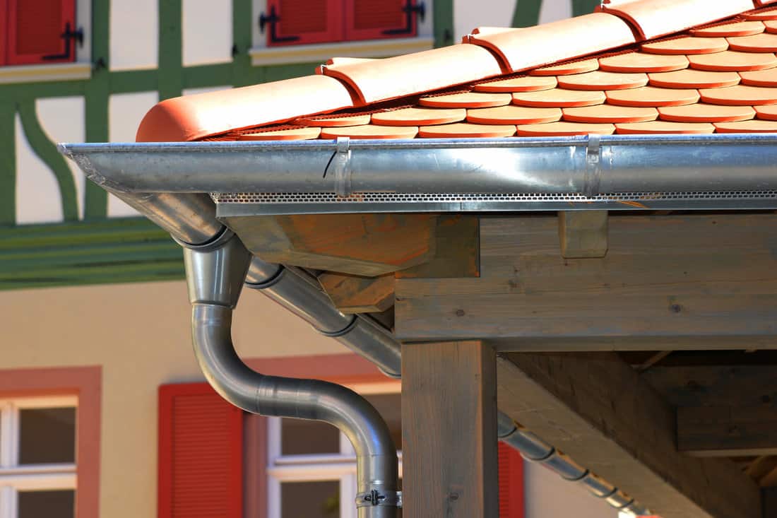 Galvanized Rain Gutter, Rainwater Pipe and Connector Nozzle at tiled Roof