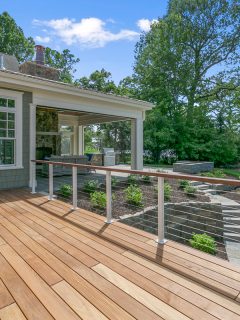 Lakeside luxury home with large wood deck and beautifully landscaped yard, Should You Power Wash A Wooden Deck? [And How To]