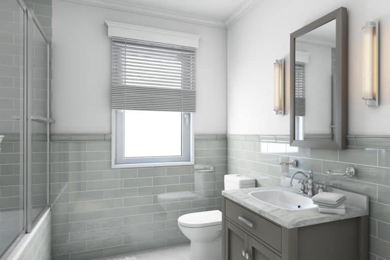 A modern gray themed bathroom, What Color Mirror Goes With A Gray Vanity? [11 Colors To Consider]