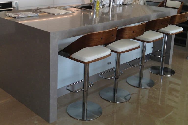 A modern luxury kitchen with countertop and counter stools, How High Should Counter Stools Be?