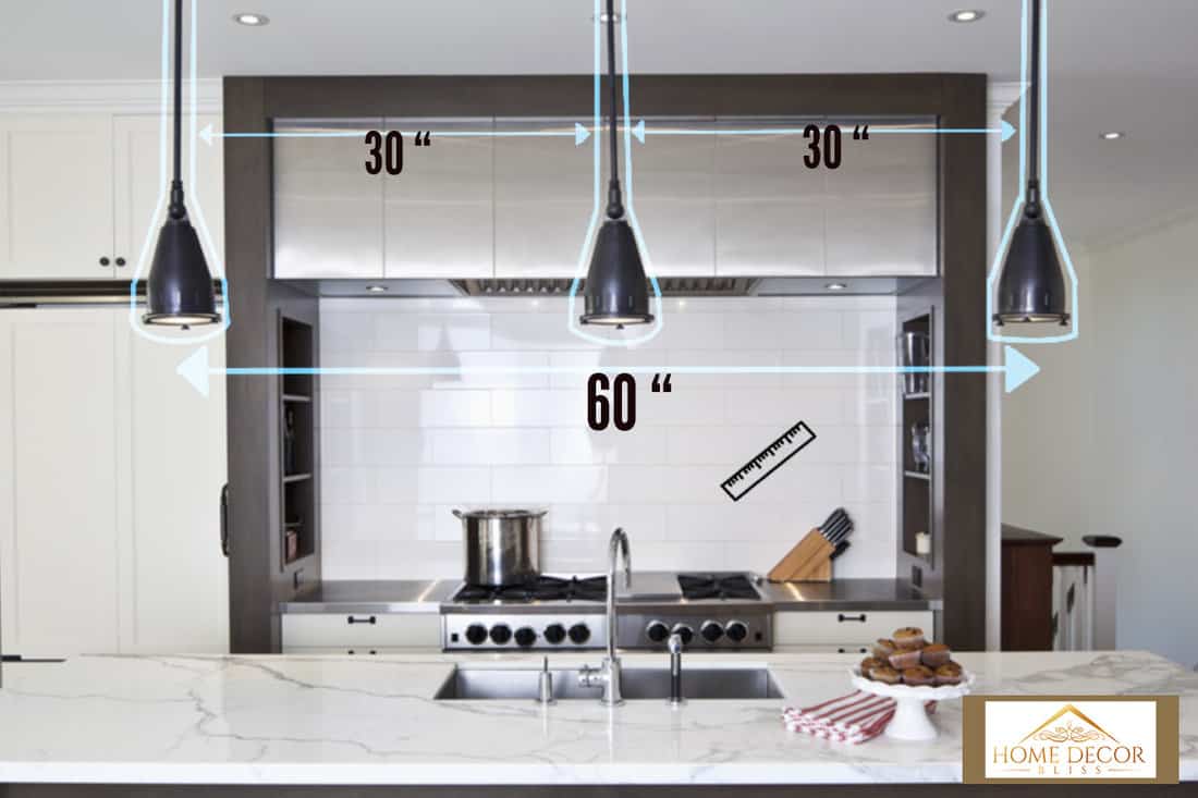 Modern, sleek kitchen in neutral palette. How Far Apart Should Island Pendant Lights Be