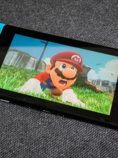 Nintendo Switch showing its screen with Super Mario Odyssey game - How To Remove Scratches From Nintendo Switch