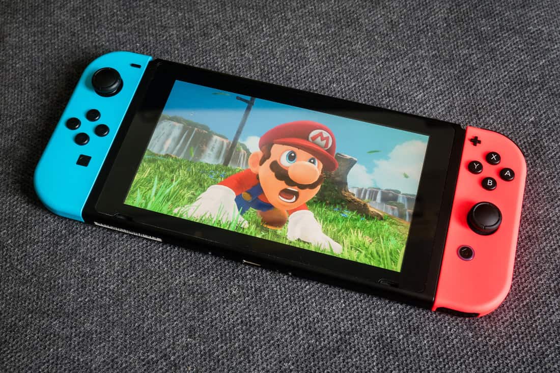Nintendo Switch showing its screen with Super Mario Odyssey game.
