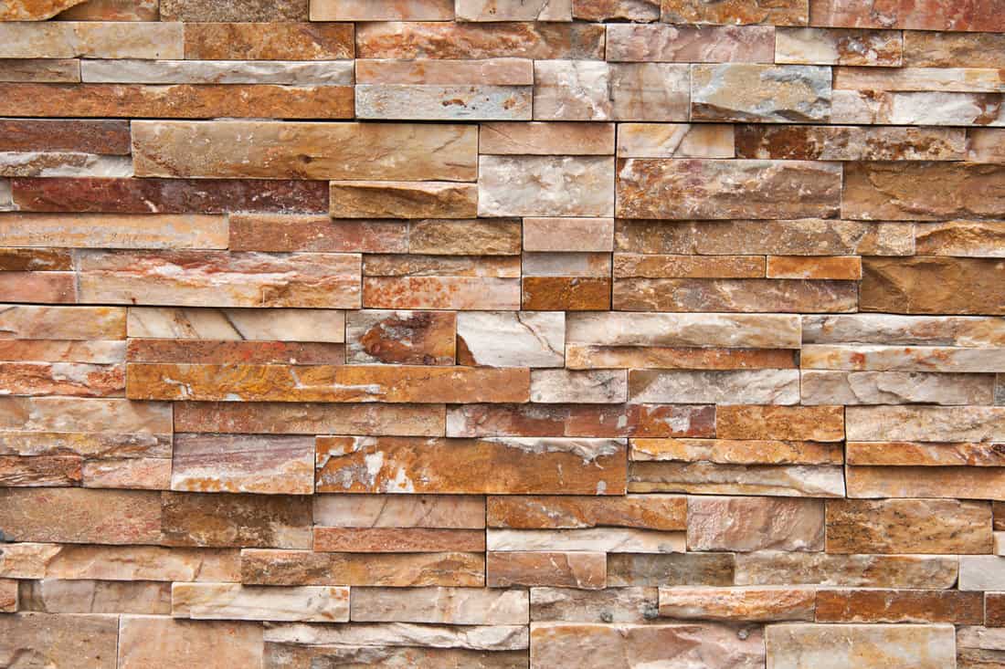 Red square stone veneer photographed up close
